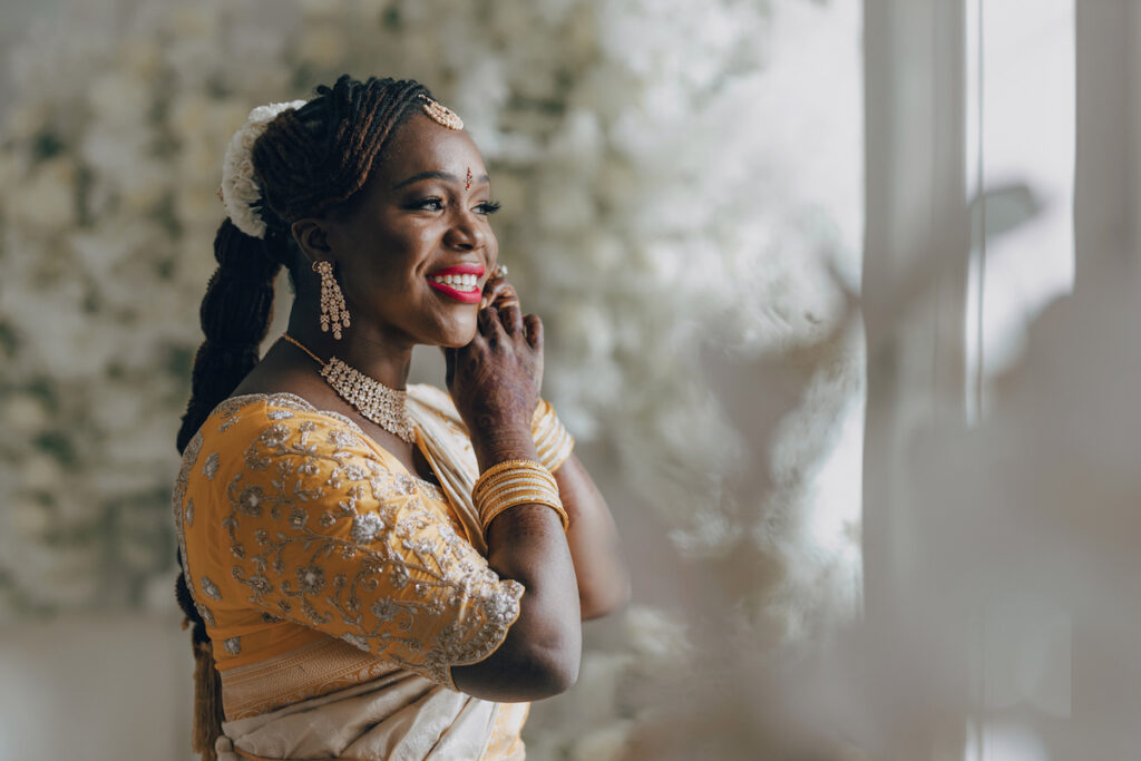 Bunmi and Kiran wed at their vibrant multicultural wedding which beautifully blended traditional Hindu and Nigerian wedding customs!