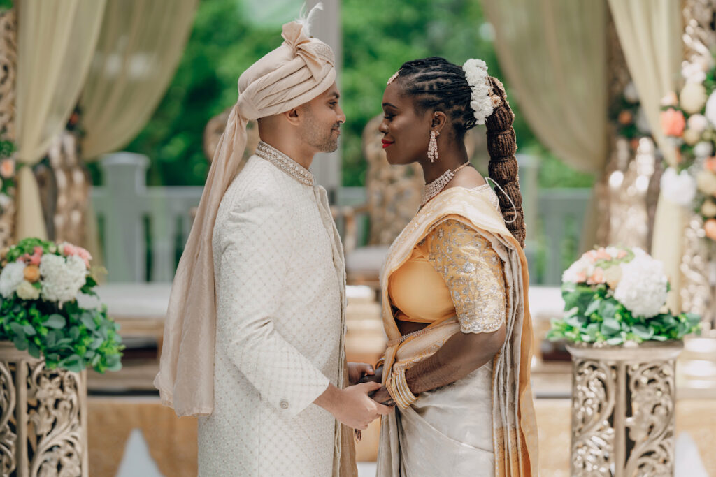 Bunmi and Kiran wed at their vibrant multicultural wedding which beautifully blended traditional Hindu and Nigerian wedding customs!