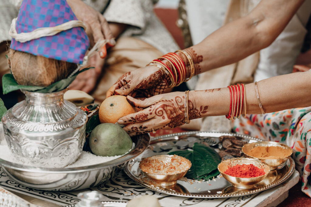 Bunmi and Kiran wed at their vibrant multicultural wedding which beautifully blended traditional Hindu and Nigerian wedding customs!