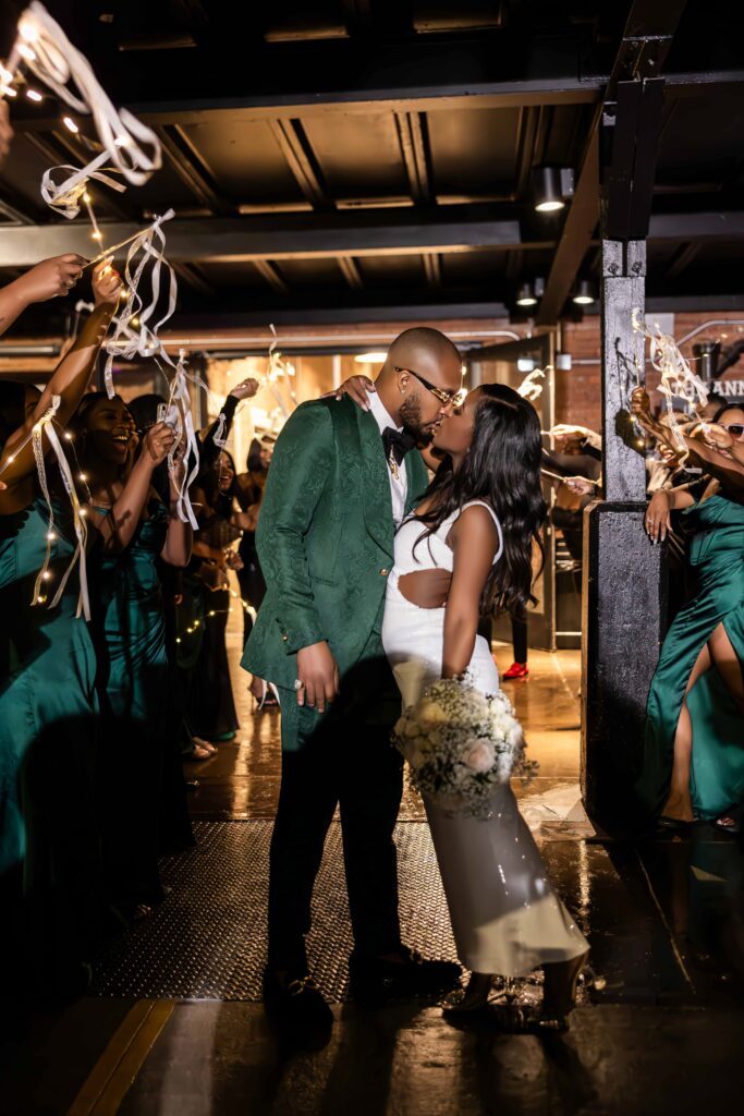 Rasmine and Tyrell's modern industrial wedding in South Carolina had luxe green and gold details and celebrated their southern heritage.