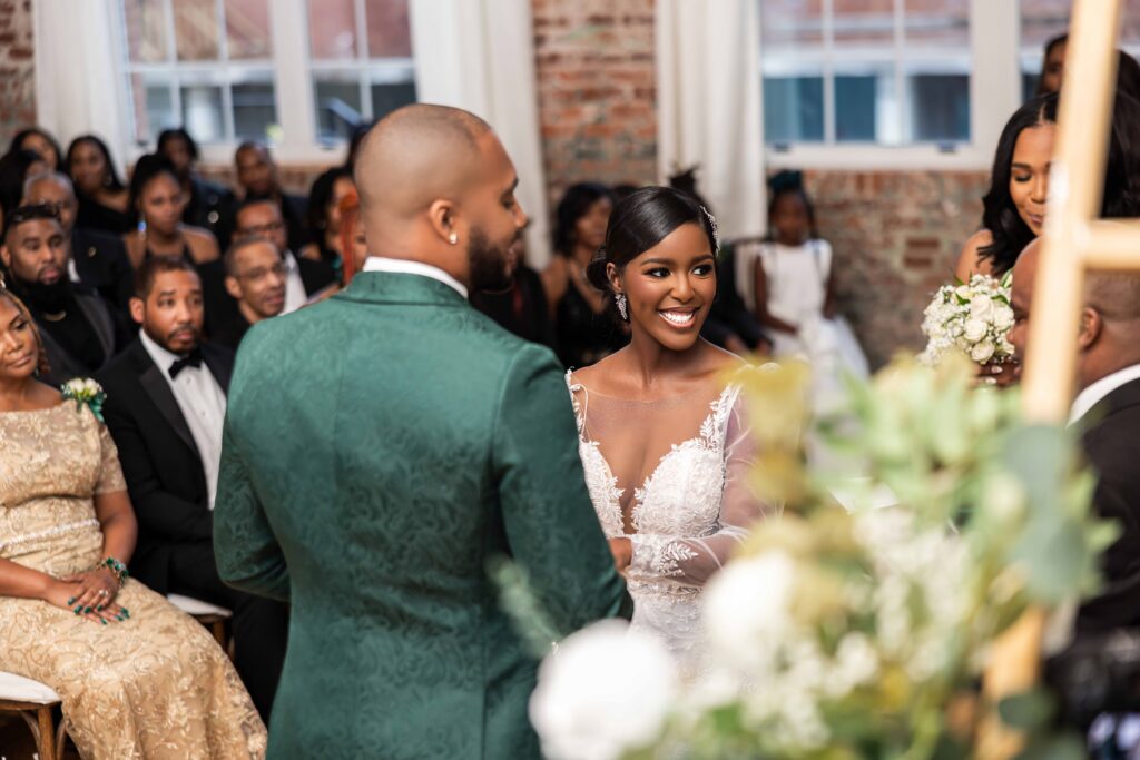 Rasmine and Tyrell's modern industrial wedding in South Carolina had luxe green and gold details and celebrated their southern heritage.