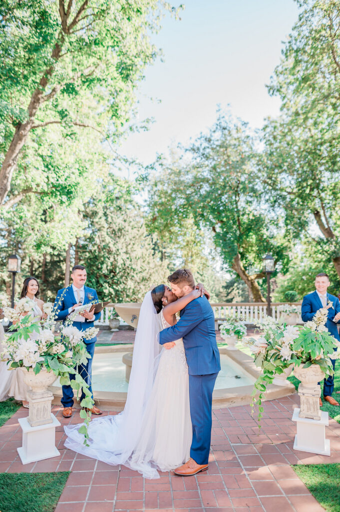 Brenda and Nolan's sunny outdoor estate wedding featured a cute something blue and a vintage phone booth built by the groom!