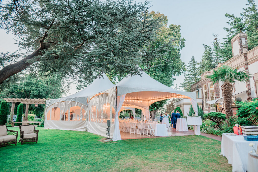 Brenda and Nolan's sunny outdoor estate wedding featured a cute something blue and a vintage phone booth built by the groom!