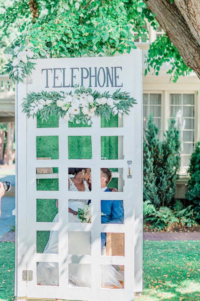 Brenda and Nolan's sunny outdoor estate wedding featured a cute something blue and a vintage phone booth built by the groom!