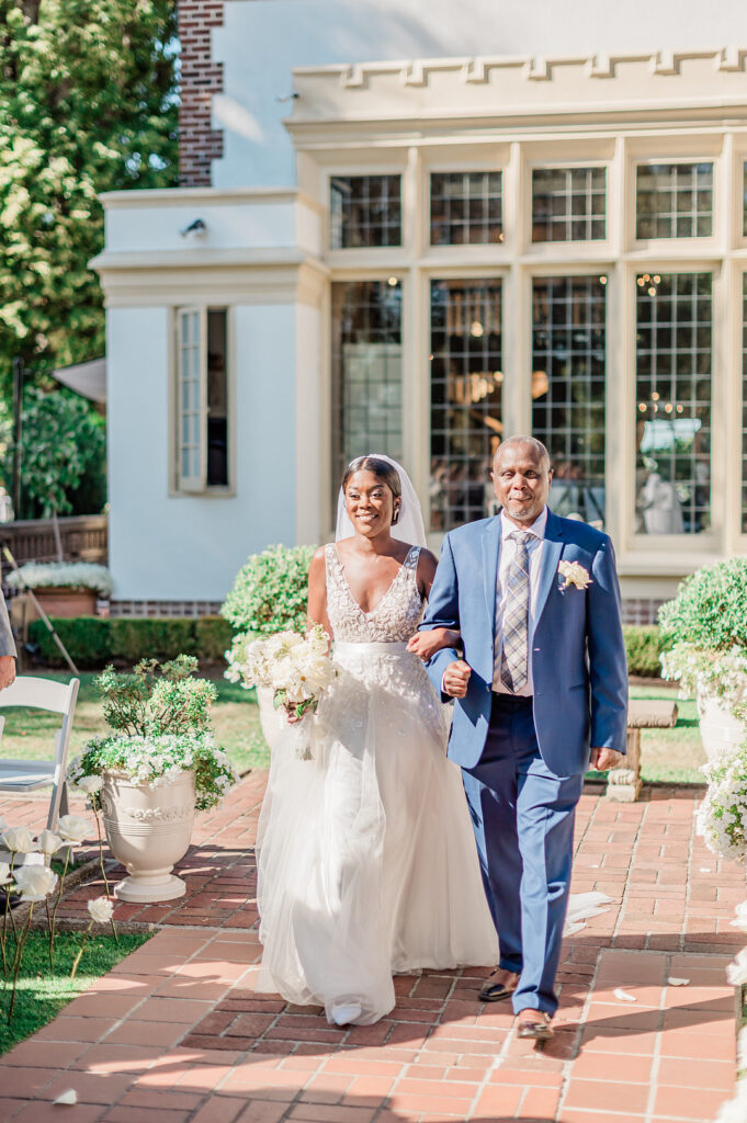 Brenda and Nolan's sunny outdoor estate wedding featured a cute something blue and a vintage phone booth built by the groom!