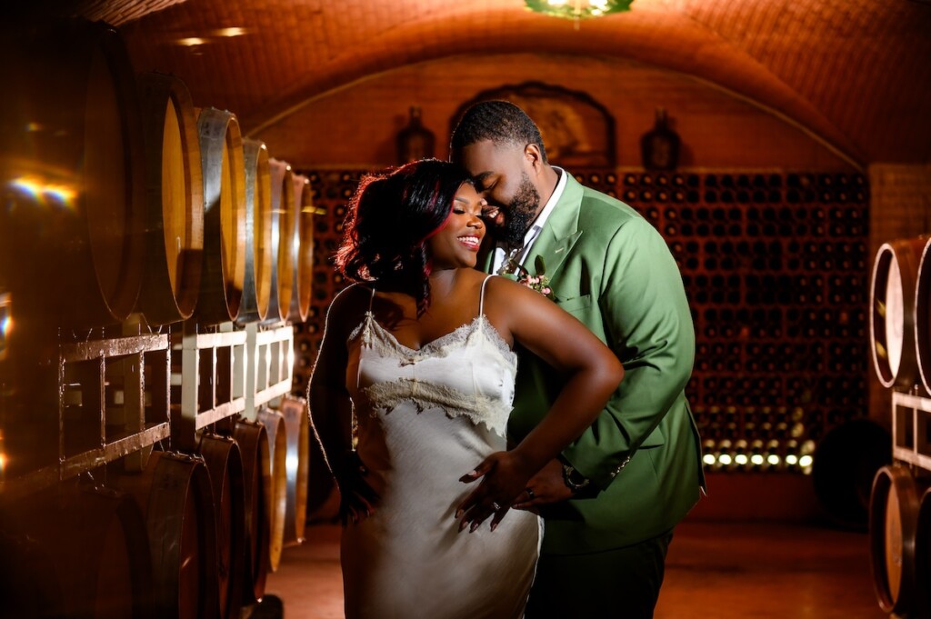 Shaniquia & Rashaad's summer vows at Morais Vineyards in Bealton, VA, featured a beautiful Portuguese-style vineyard with lush greenery.