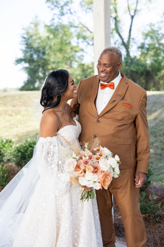 Rich fall hues of brown, auburn, and gold were seen throughout Ashley and Dee's intimate chapel wedding in Flora, Mississippi. 