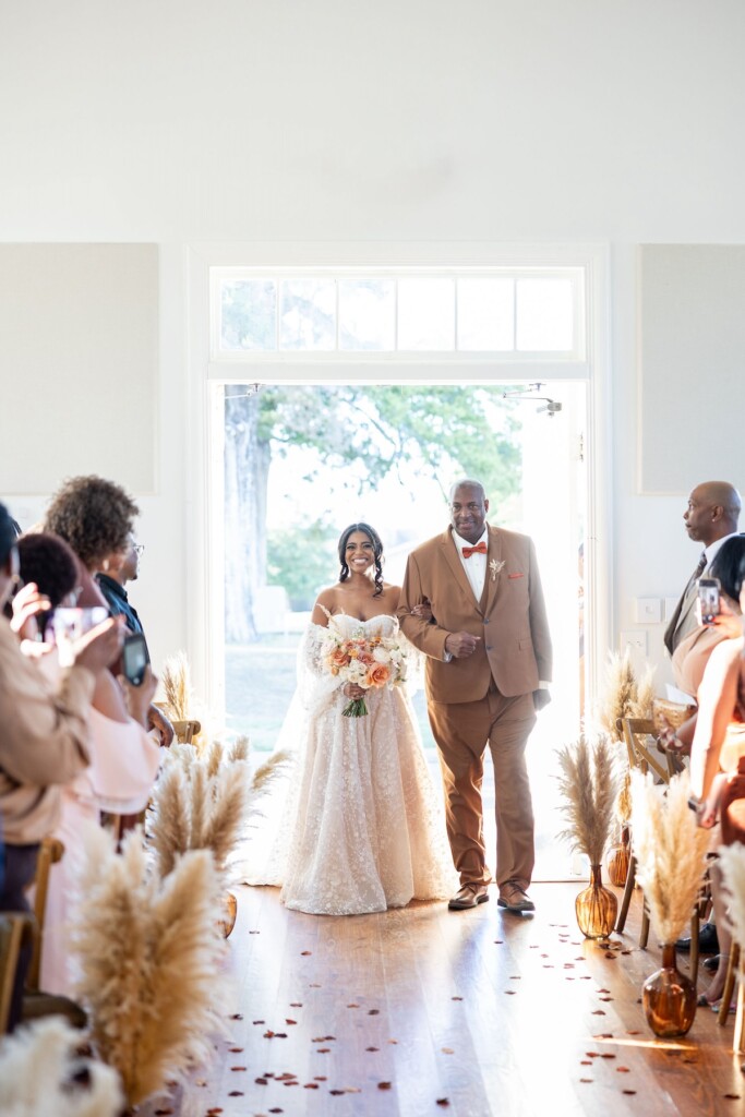 Rich fall hues of brown, auburn, and gold were seen throughout Ashley and Dee's intimate chapel wedding in Flora, Mississippi. 