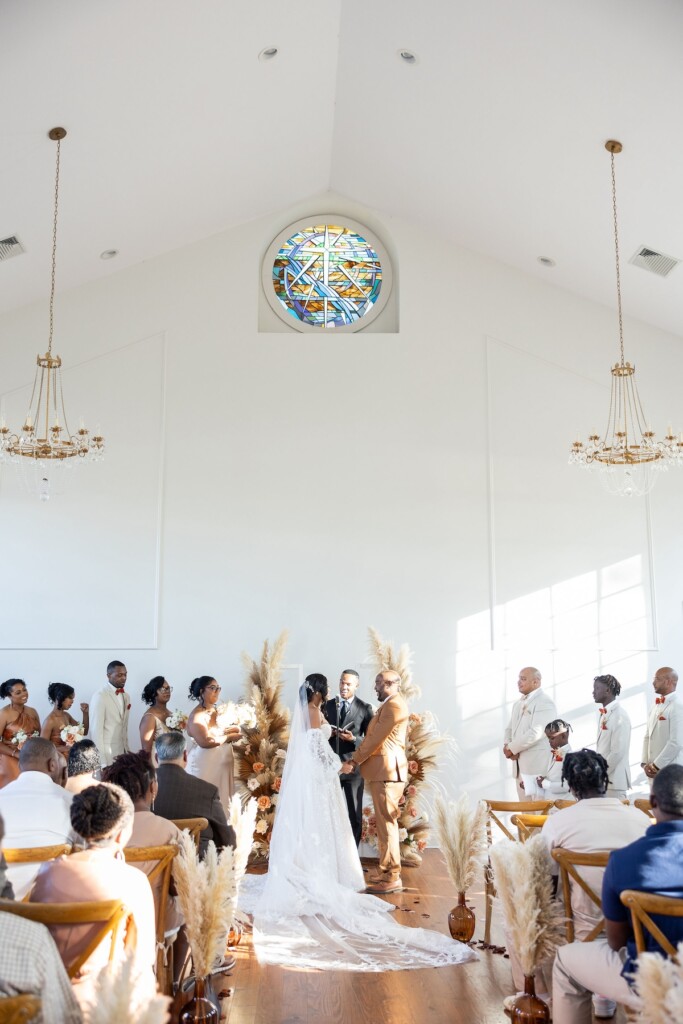 Rich fall hues of brown, auburn, and gold were seen throughout Ashley and Dee's intimate chapel wedding in Flora, Mississippi. 