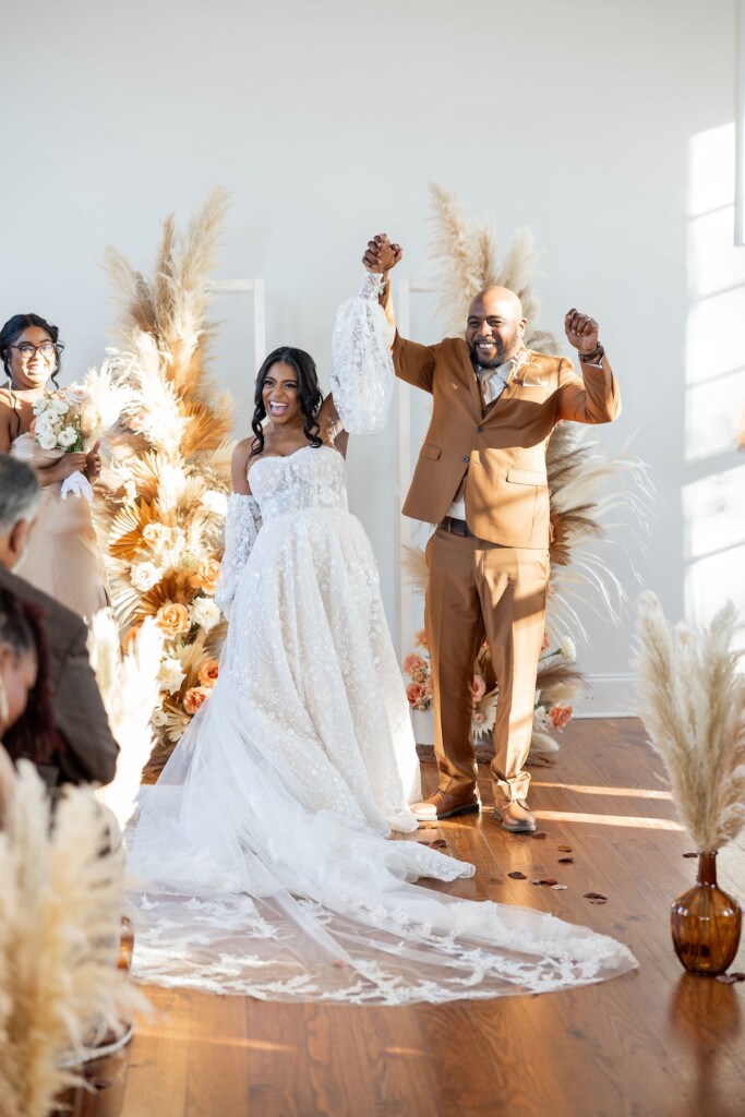 Rich fall hues of brown, auburn, and gold were seen throughout Ashley and Dee's intimate chapel wedding in Flora, Mississippi. 