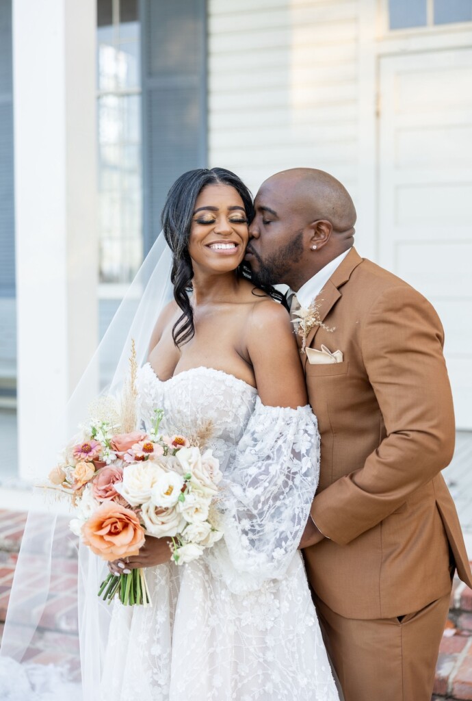 Rich fall hues of brown, auburn, and gold were seen throughout Ashley and Dee's intimate chapel wedding in Flora, Mississippi. 