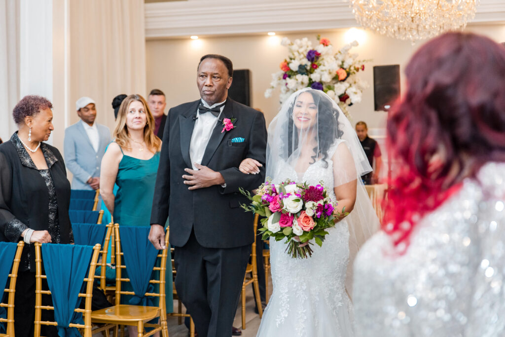 Vibrant jewel-toned colors and fun entertainment (including a caricaturist) made this ballroom wedding in South Carolina one of a kind.