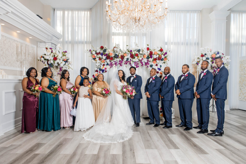 Vibrant jewel-toned colors and fun entertainment (including a caricaturist) made this ballroom wedding in South Carolina one of a kind.