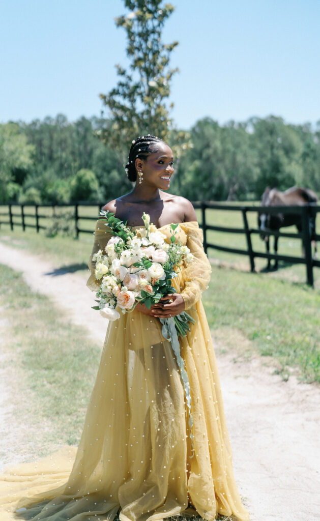 This playful sun-filled styled wedding shoot in Florida features gorgeous florals, pretty pearls, and royal honey hues.