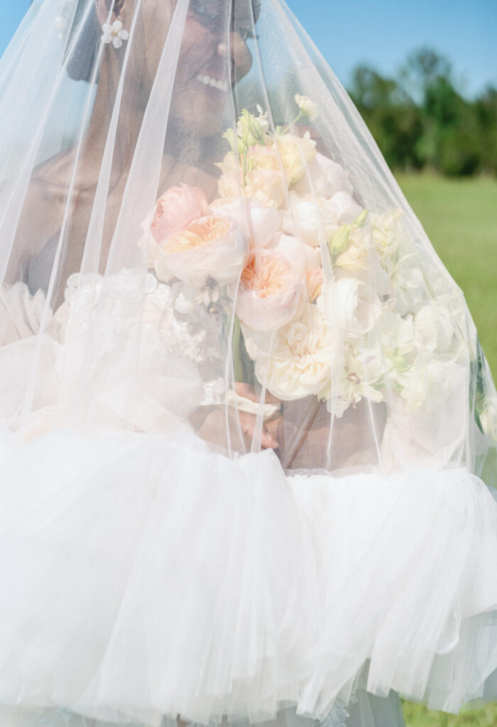 This playful sun-filled styled wedding shoot in Florida features gorgeous florals, pretty pearls, and royal honey hues.