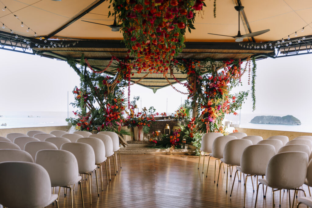 Opulent tropical florals mixed with a beautiful ocean-side estate made this destination wedding in Costa Rica a dream come true!