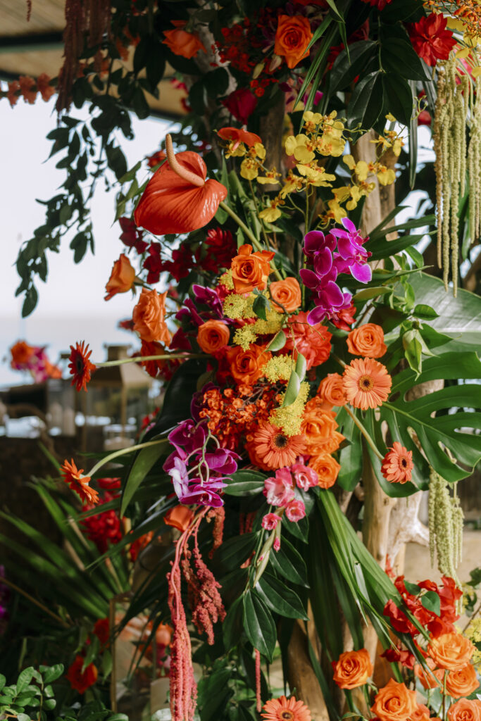 Opulent tropical florals mixed with a beautiful ocean-side estate made this destination wedding in Costa Rica a dream come true!