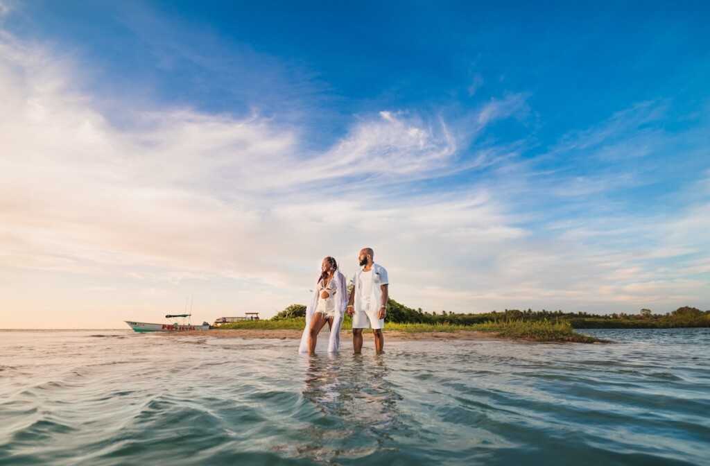 Kerron Duncan and Dr. Malika Grayson tied the knot in a beautiful destination wedding at Pigeon Point Heritage Park, Tobago.