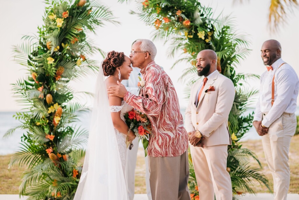 Kerron Duncan and Dr. Malika Grayson tied the knot in a beautiful destination wedding at Pigeon Point Heritage Park, Tobago.