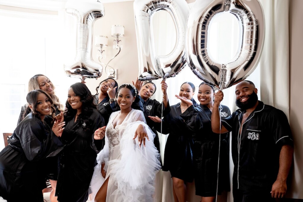 Arianna and Philip wed in a classic black and white wedding at The Georgian Terrace in Atlanta with soft pinks, golds, and romantic details.