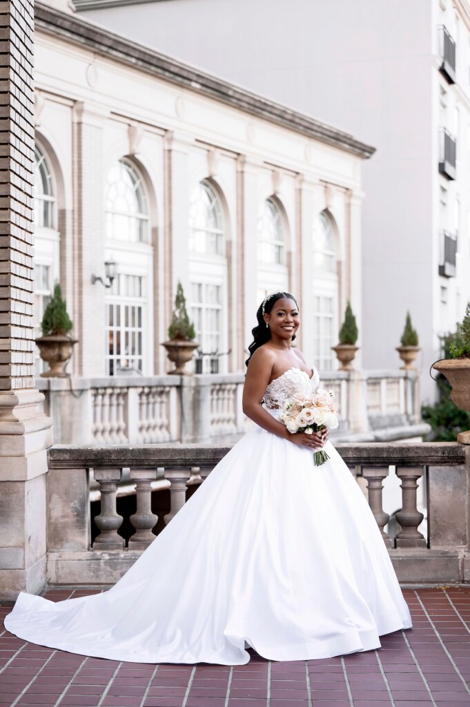 Arianna and Philip wed in a classic black and white wedding at The Georgian Terrace in Atlanta with soft pinks, golds, and romantic details.