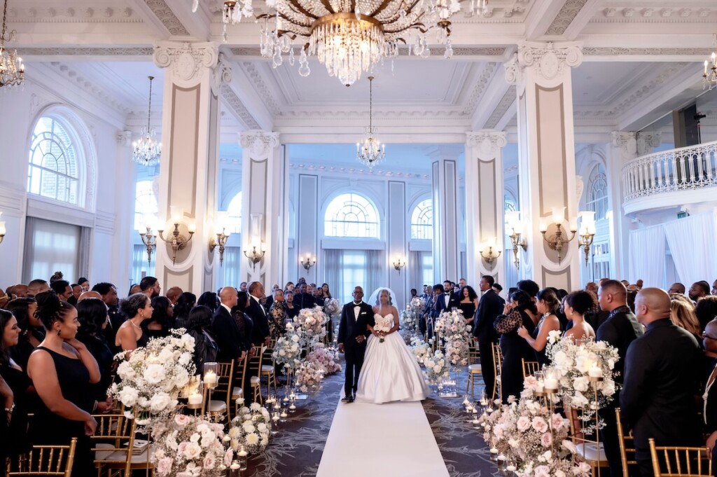 Arianna and Philip wed in a classic black and white wedding at The Georgian Terrace in Atlanta with soft pinks, golds, and romantic details.