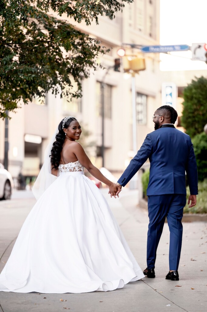 Arianna and Philip wed in a classic black and white wedding at The Georgian Terrace in Atlanta with soft pinks, golds, and romantic details.