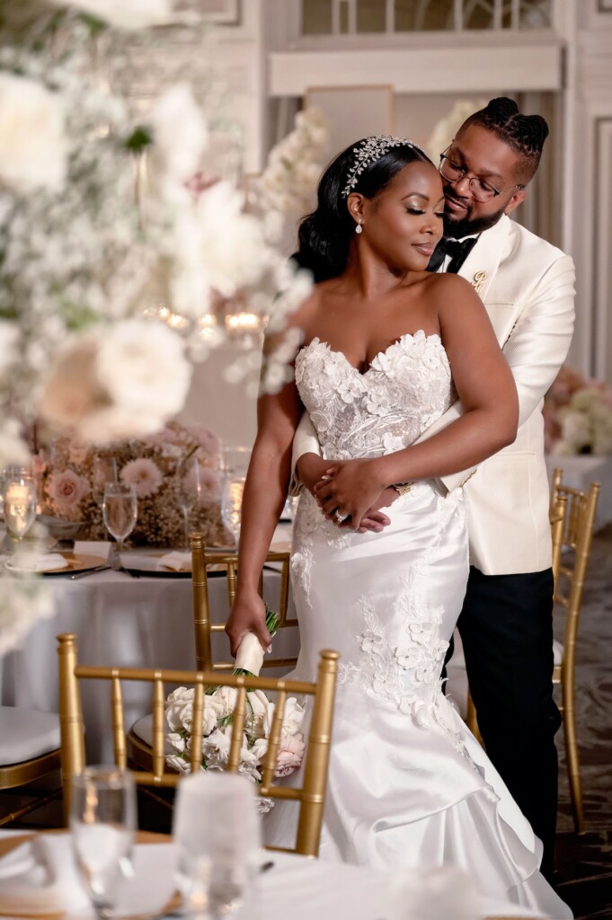 Arianna and Philip wed in a classic black and white wedding at The Georgian Terrace in Atlanta with soft pinks, golds, and romantic details.