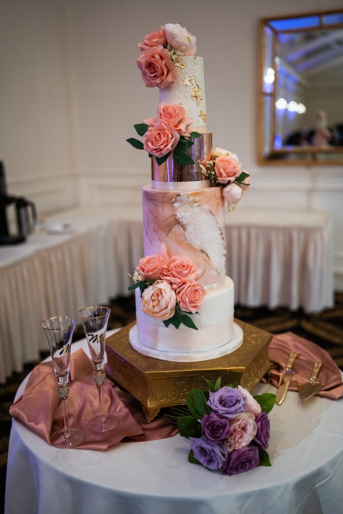 Khrystina and Ray's luxury golf resort wedding on Lake Norman featured bright pastels, vibrant florals, and regal dining room reception decor.