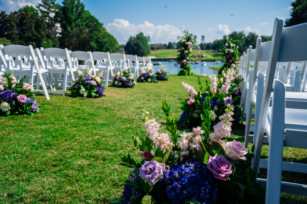 Khrystina and Ray's luxury golf resort wedding on Lake Norman featured bright pastels, vibrant florals, and regal dining room reception decor.