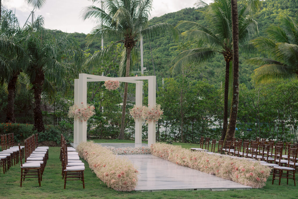 Krystal and Alonzo’s dreamy tropical garden wedding in Marigot Bay, St. Lucia features custom fashion and romantic pink blooms!