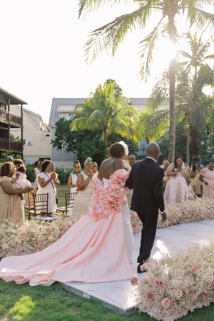 Krystal and Alonzo’s dreamy tropical garden wedding in Marigot Bay, St. Lucia features custom fashion and romantic pink blooms!