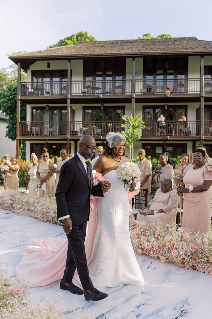 Krystal and Alonzo’s dreamy tropical garden wedding in Marigot Bay, St. Lucia features custom fashion and romantic pink blooms!