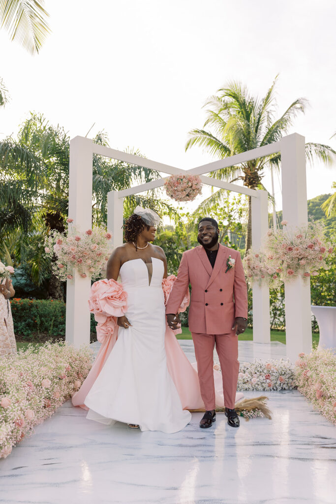 Krystal and Alonzo’s dreamy tropical garden wedding in Marigot Bay, St. Lucia features custom fashion and romantic pink blooms!