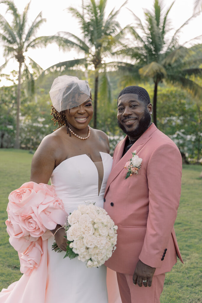 Krystal and Alonzo’s dreamy tropical garden wedding in Marigot Bay, St. Lucia features custom fashion and romantic pink blooms!