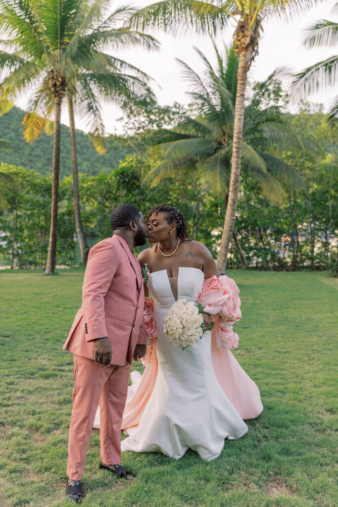 Krystal and Alonzo’s dreamy tropical garden wedding in Marigot Bay, St. Lucia features custom fashion and romantic pink blooms!