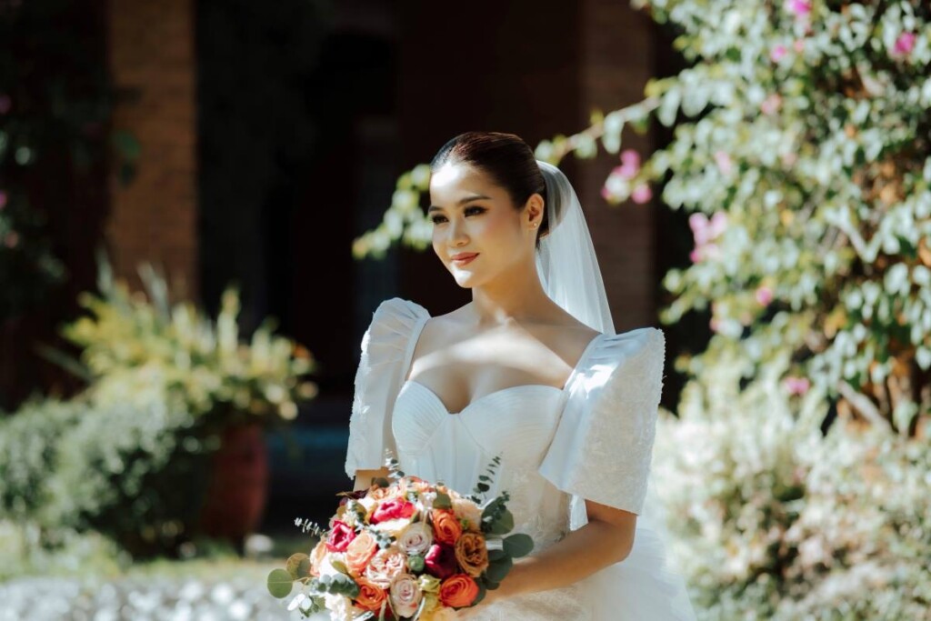 After starting their relationship in secret over a decade ago, Marck and Lovely celebrated their union with an elegant garden wedding at the stunning San Agustin Church, a UNESCO World Heritage Site in the Philippines. 