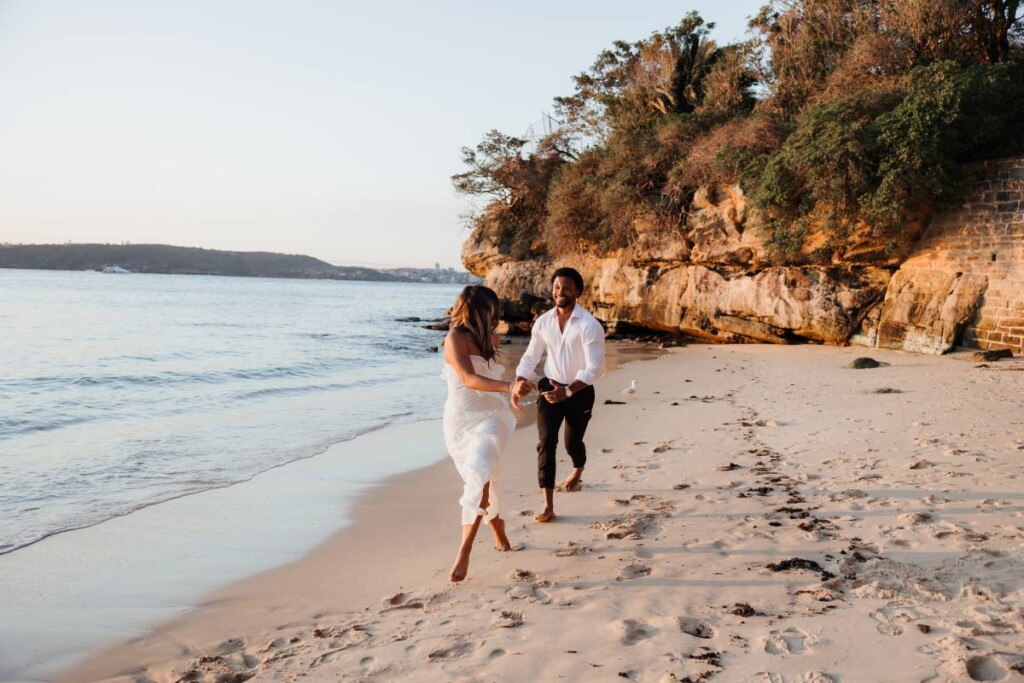 Joshua and Aly let their love shine through in a playful, beachy engagement session on the shores of Watsons Bay in Sydney, Australia.